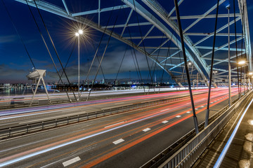 Fototapeta na wymiar Famous bridge in Rotterdam over the Muse highway A16