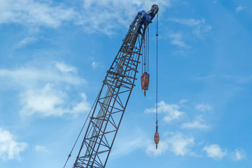 Crane lift of  green on blue sky background