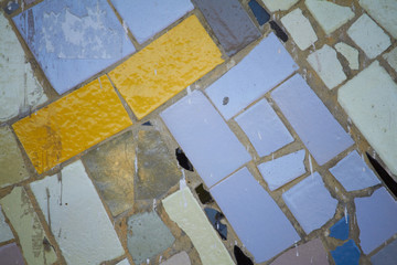 Abstract element of multicolored ceramic mosaic, selective focus.