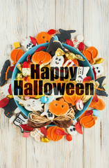 Halloween holiday card - candy bowl with candy and halloween cookies Trick or Treat	