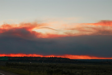 Road Trip during wildfires on the horizon in Arizona. Climate change, wildfires, dramatic views.