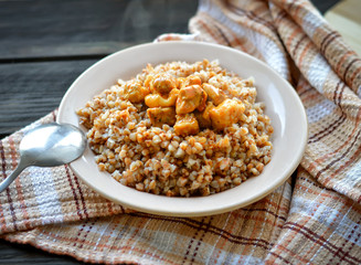 Buckwheat with meat on the table.