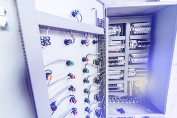 Electrical panel at a assembly line factory. Controls and switches.