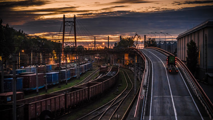 Fototapeta na wymiar Industrial bridge over the railway in the port.