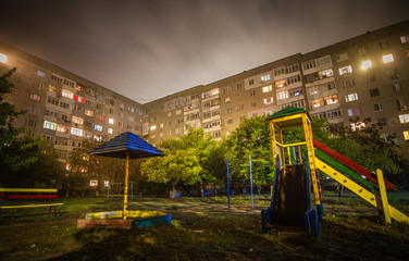 Empty playground in the night city.