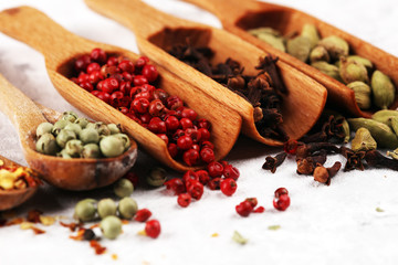 Spices with pepper on table. Food and cuisine ingredients for cooking on rustic background