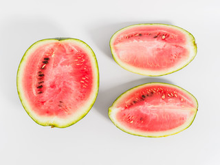 Halved watermelon on white background.