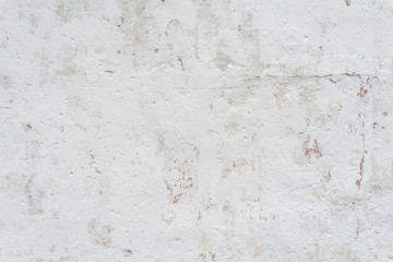texture of a white wall with a damaged stucco layer, architecture abstraction background