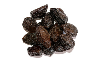 Prunes. Fresh black dried prunes isolated on white background. Pile of dried prunes. Top view