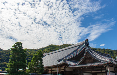 Fototapeta premium Cloudy sky over temple building in Kyoto Japan