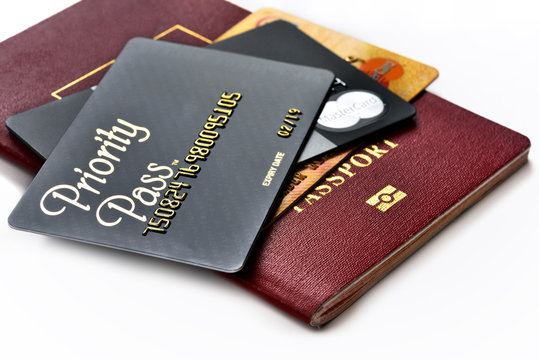 RUSSIA, MOSCOW - FEB 22, 2015: Priority Pass Card For VIP Lounge Access And Premium Credit Cards MasterCard Black Edition And MasterCard Gold On The International Passport. VIP Travel Concept