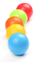 Colored plastic balls on white background