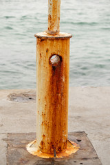Rusty lamppost on a pier in the autumn season