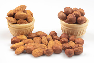 Different nuts in a waffle basket on a white background. Vitamin wholesome food.