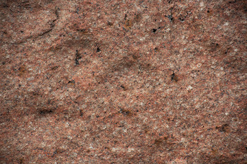 Rough uneven red stone wall