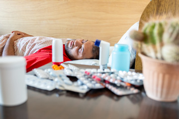 Arabic man feeling sick and taking rest