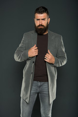 Beard makes man look more brutal. Stylish man on grey background. Bearded hipster man wear casual clothing. Caucasian man with long mustache and beard hair