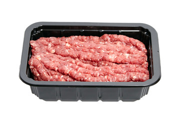 Ground beef in a black plastic tray isolated on white background. Uncooked mincemeat. Forcemeat, fresh raw minced meat