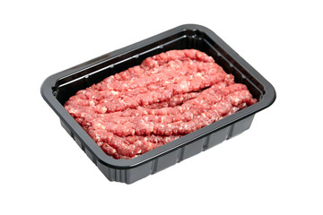 Ground beef in a black plastic tray isolated on white background. Uncooked mincemeat. Forcemeat, fresh raw minced meat