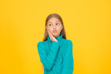 See your dentist as soon as possible. Little child suffer from toothache yellow background. Anti...