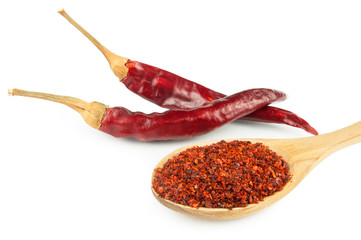 red dried crushed hot chili peppers and chili flakes or powder isolated on white background, healthy turkish spice