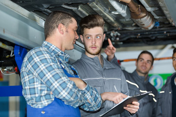 mechanic and apprentice in factory