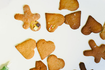 Homemade gingerbread cookies with colorful decorations and chocolates.