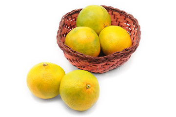 Yellow-green tangerines on a white background