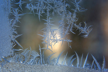 frosty patterns on the window glass closeup