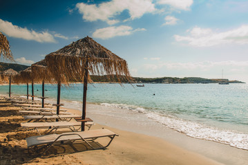 beach with chairs and umbrellas