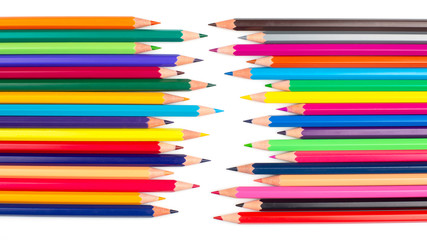 Colored pencils for drawing on a white background. Education and creativity. Leisure and art