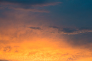 Naklejka na ściany i meble Abstract beautiful sunrise and dramatic clouds on the sky.