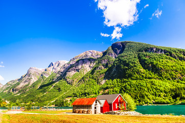 Norwegian Sognefjord  with a typical red house - Powered by Adobe