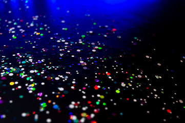 Colorful lights blurred glitter background. Abstract illuminated texture. Christmas, new year or birthday celebration. Night life photography