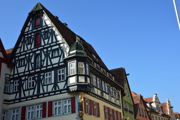 Fototapeta na wymiar Rothenburg (Germany) April 2017. The central street of the city. Old medieval houses.