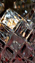 Crystal Glass photographed in macro reds, blues, gold, Reflections patterns and mettalic look and feelrepeating patterns contrast