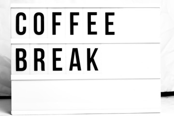 Coffee Break displayed on a vintage Retro Lightbox. Flat Lay Concept image