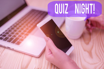 Text sign showing Quiz Night. Business photo showcasing evening test knowledge competition between individuals woman laptop computer smartphone mug office supplies technological devices