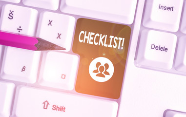 Handwriting text writing Checklist. Conceptual photo list items required things be done or points considered White pc keyboard with empty note paper above white background key copy space