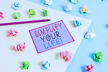 Conceptual hand writing showing Simplify Your Life. Concept meaning focused on important and let someone else worry about less ones Colored crumpled papers empty reminder blue yellow clothespin