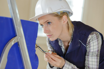 portrait of a female electrician during wiring