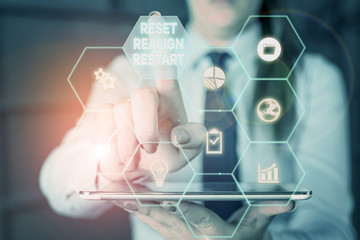 Writing note showing Reset Realign Restart. Business concept for Life audit will help you put things in perspectives Woman wear formal work suit present using smart latest device