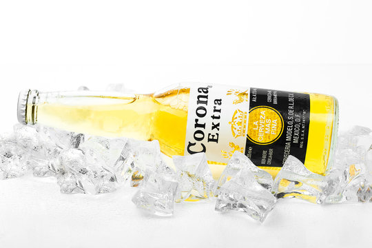 Frosty bottle of Corona Extra beer isolated on white