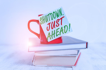 Conceptual hand writing showing Shutdown Just Ahead. Concept meaning closing factory business...