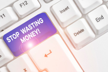 Word writing text Stop Wasting Money. Business photo showcasing advicing demonstrating or group to start saving and use it wisely White pc keyboard with empty note paper above white background key