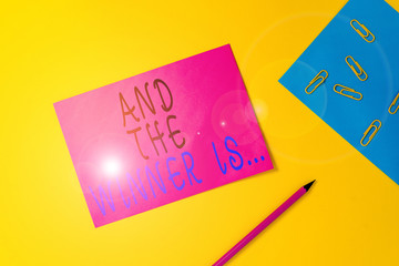 Writing note showing And The Winner Is. Business concept for announcing a demonstrating or thing...