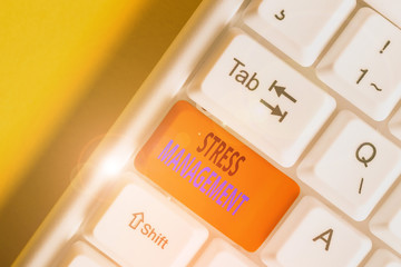 Conceptual hand writing showing Stress Management. Concept meaning method of limiting stress and its effects by learning ways White pc keyboard with note paper above the white background