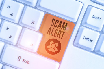 Handwriting text Scam Alert. Conceptual photo unsolicited email that claims the prospect of a...