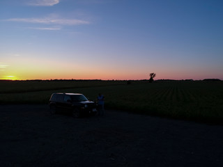 Fototapeta na wymiar Arial view of a sunset over a farm