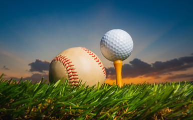 golf ball on tee pegs ready to play baseball on the green lawn at sunset with clouds in the evening day background,